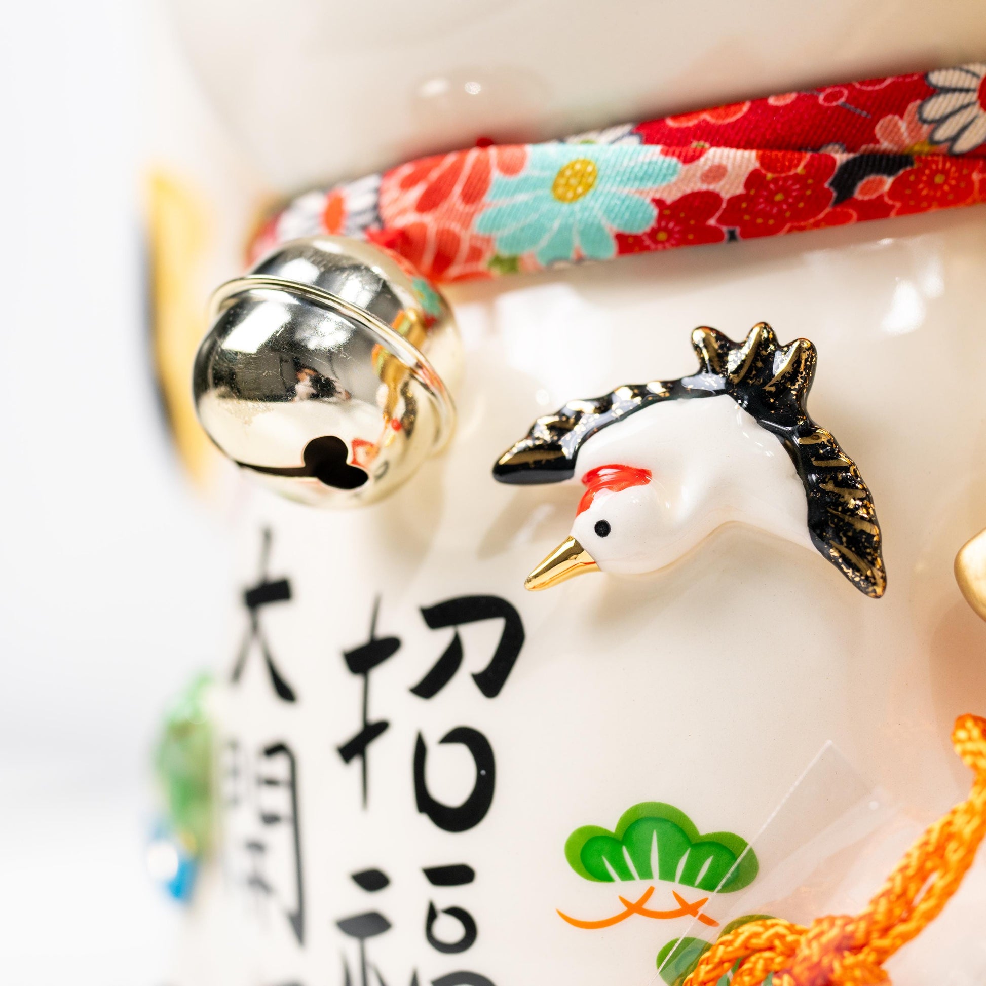 Side detail of decorative motifs on Yakushi Kiln lucky cat