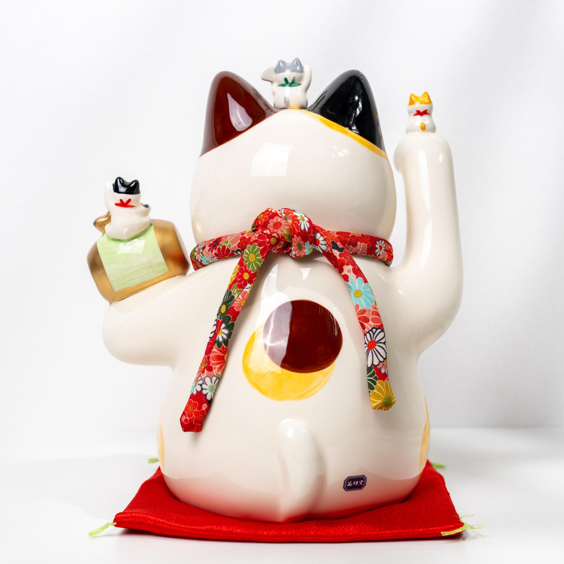 Side profile of ceramic lucky cat figurine for decor