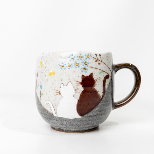 Hand-painted Kutani cat mug with cuddling cats and blue blossoms