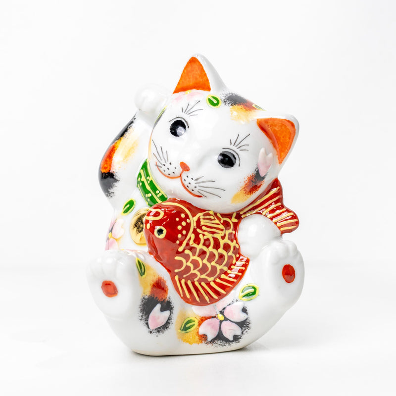 Kutani Tai Maneki Neko lucky cat with red sea bream on white background