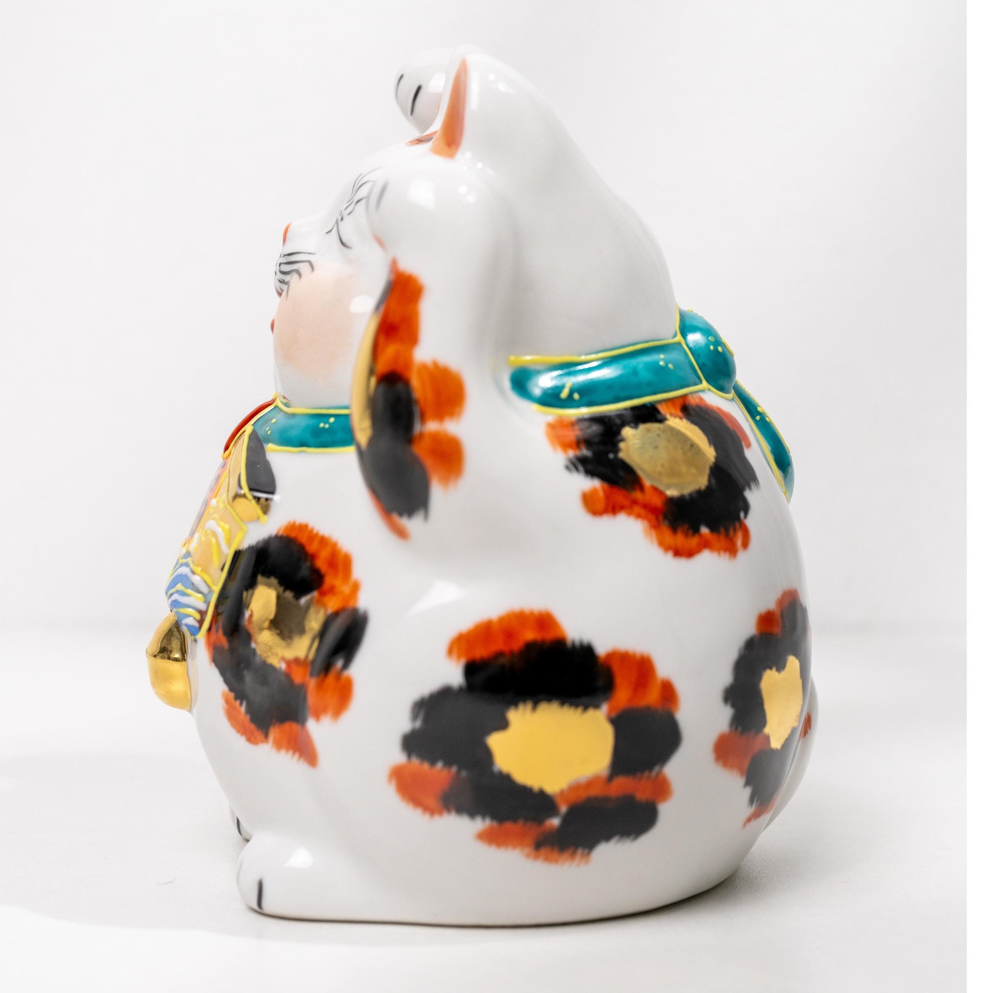 Side view of Kutani gold calico Maneki Neko