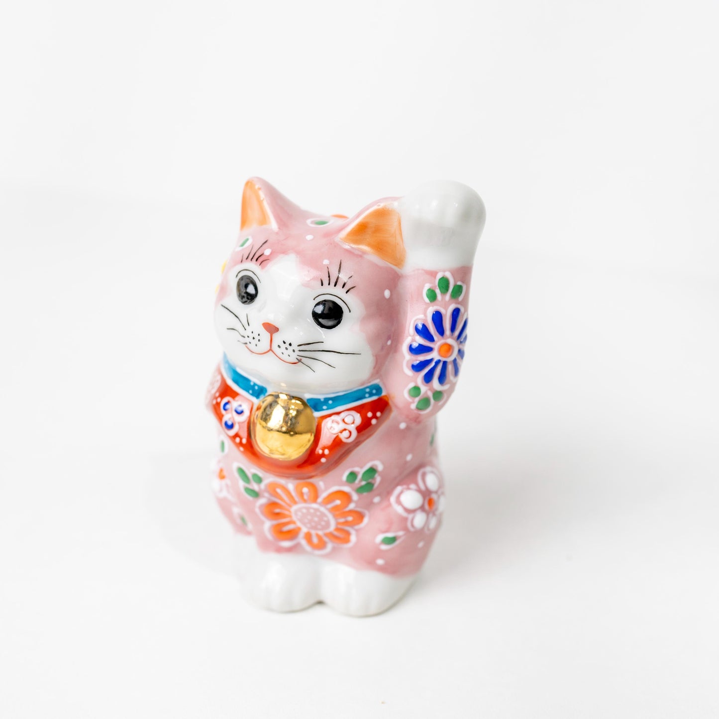 Front view of small pink lucky cat figurine