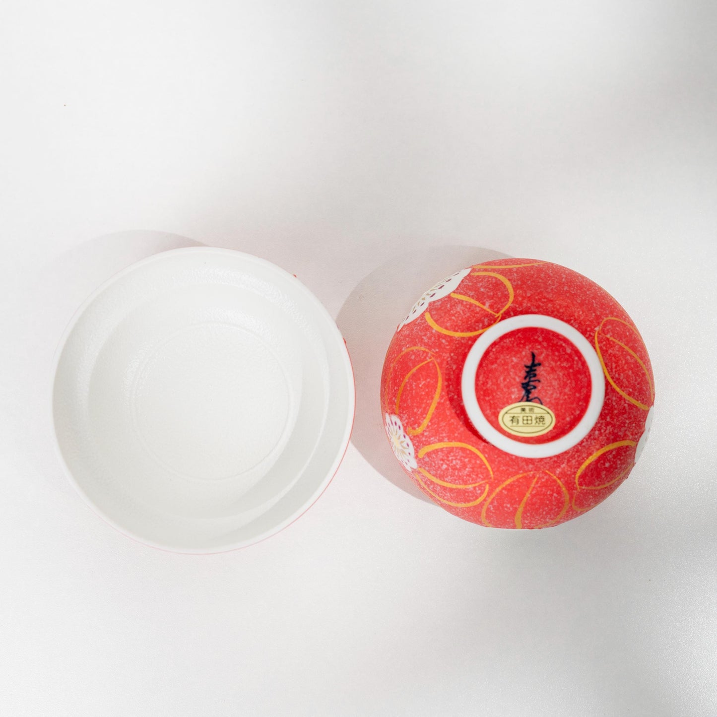 Interior view of red Arita lidded bowl in white glazed porcelain