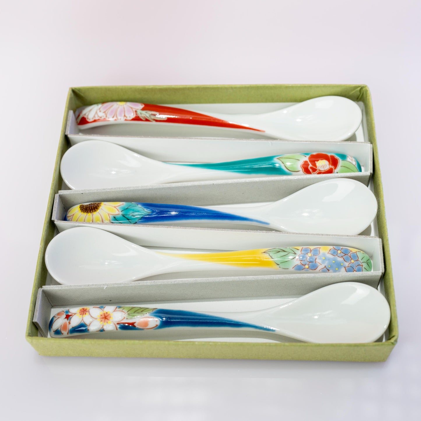 Top view of Kutani floral spoons in assorted designs