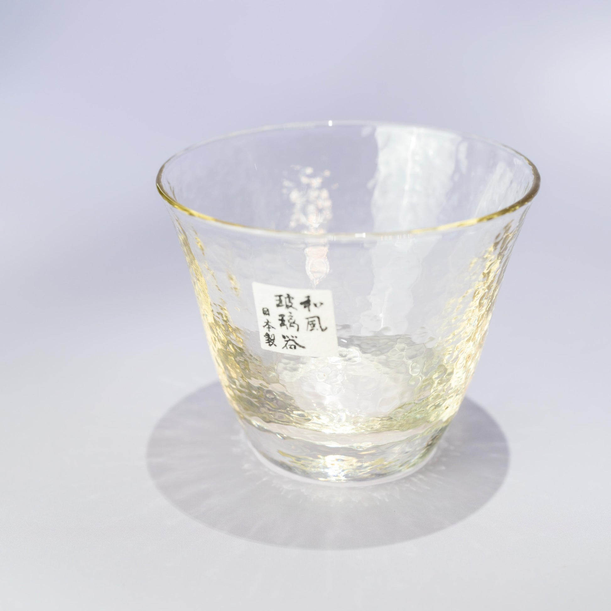Top detail of the inner ice pocket in the amber glass carafe