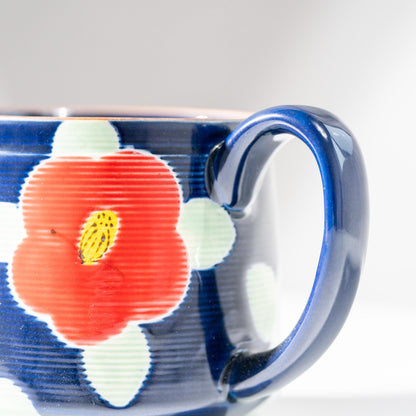 Detail of hand-painted camellia motif on Arita porcelain teapot