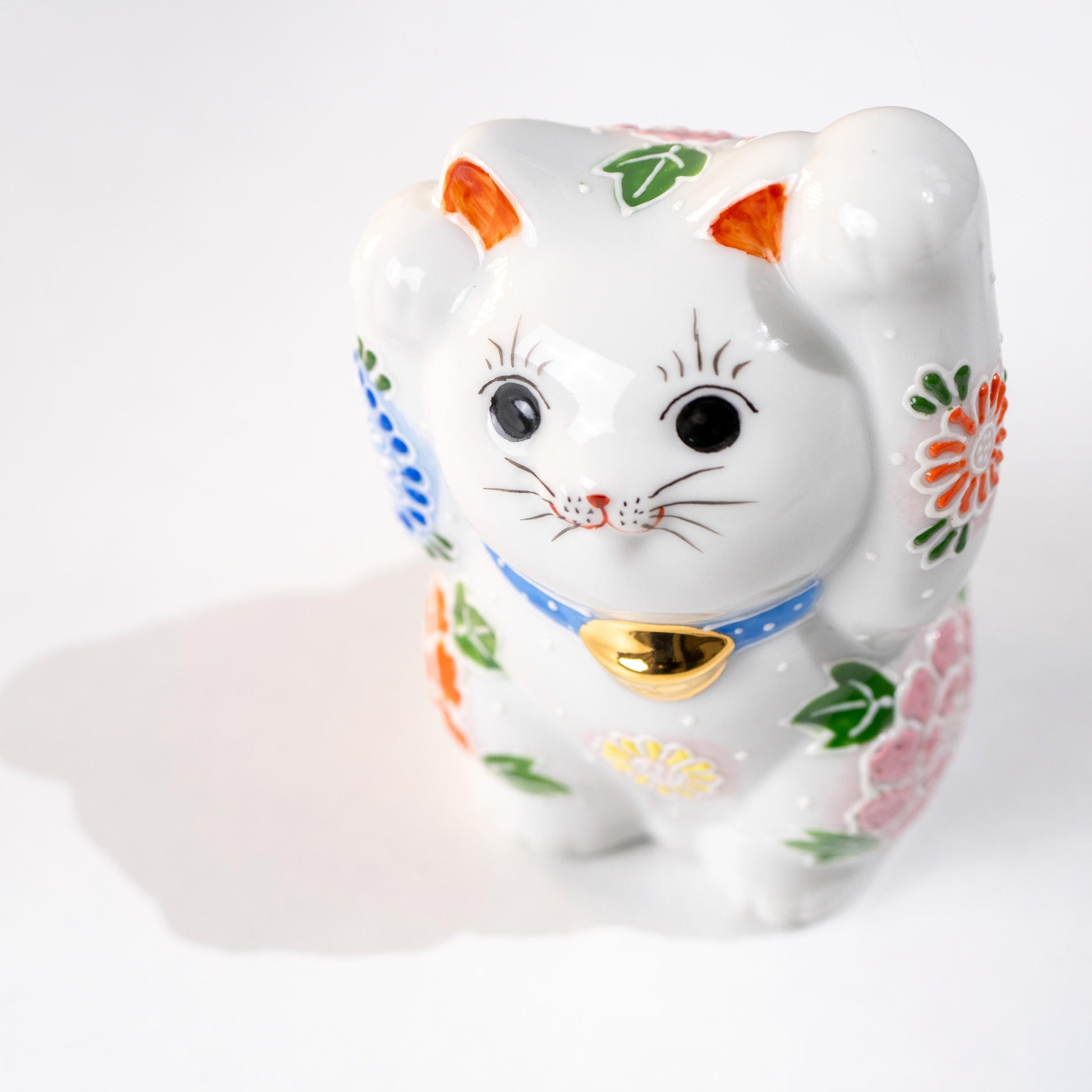Front angle of Japanese double paw lucky cat
