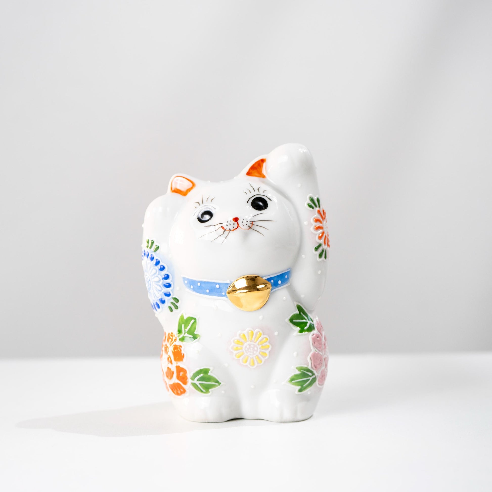 Kutani double paw Maneki Neko on white background