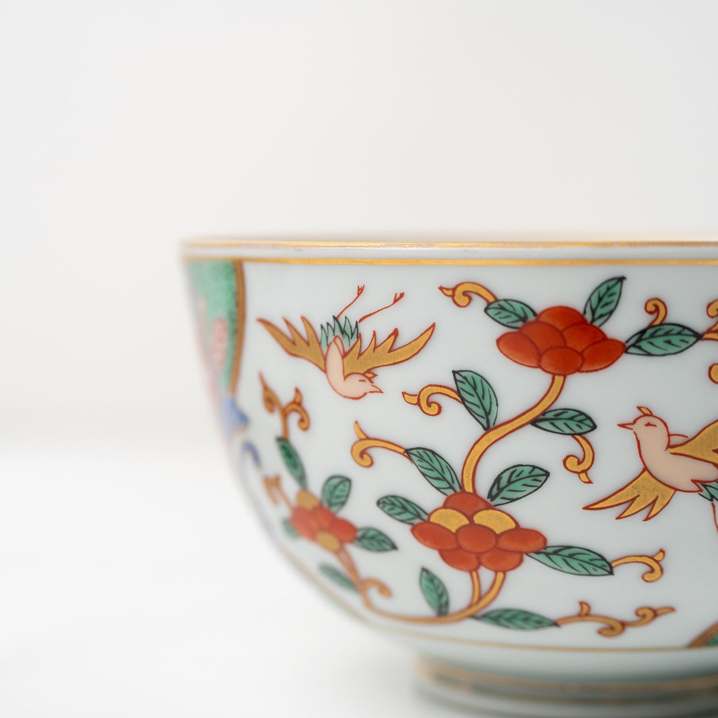Close-up of hand-painted decoration on the side of the bowl