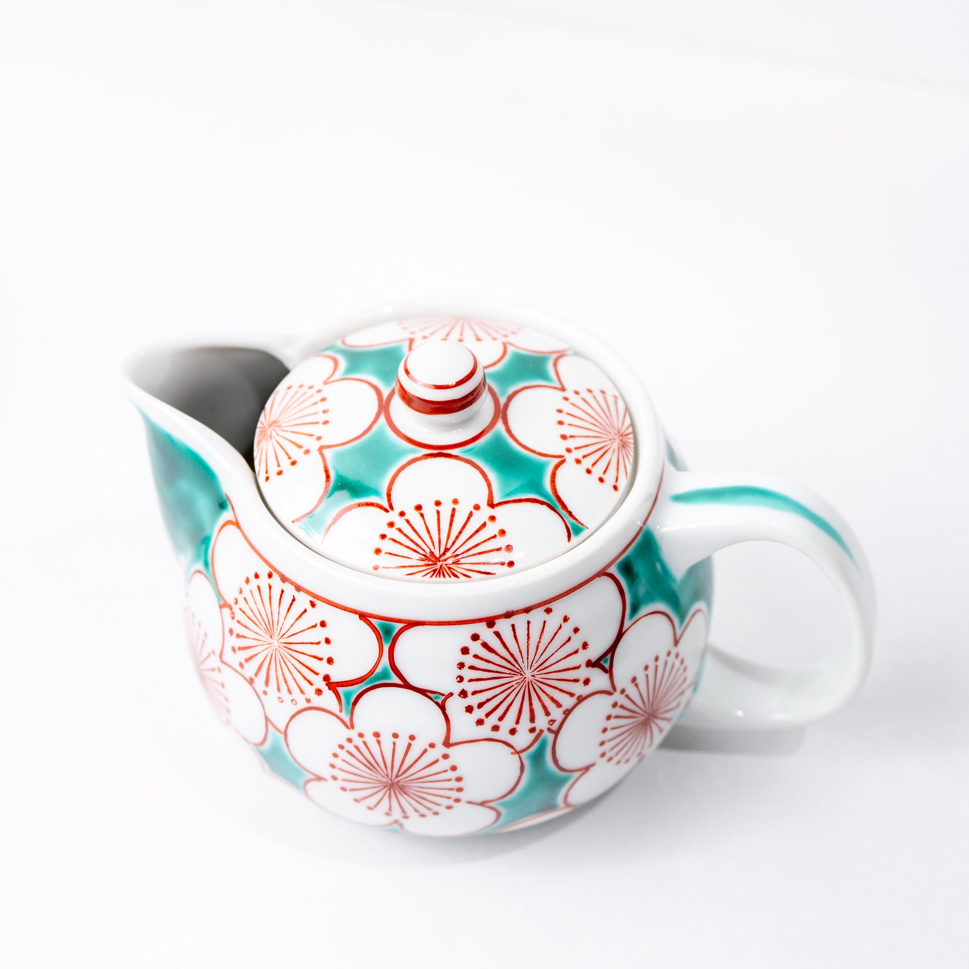 Front view of Kutani tea set with teapot and matching cups