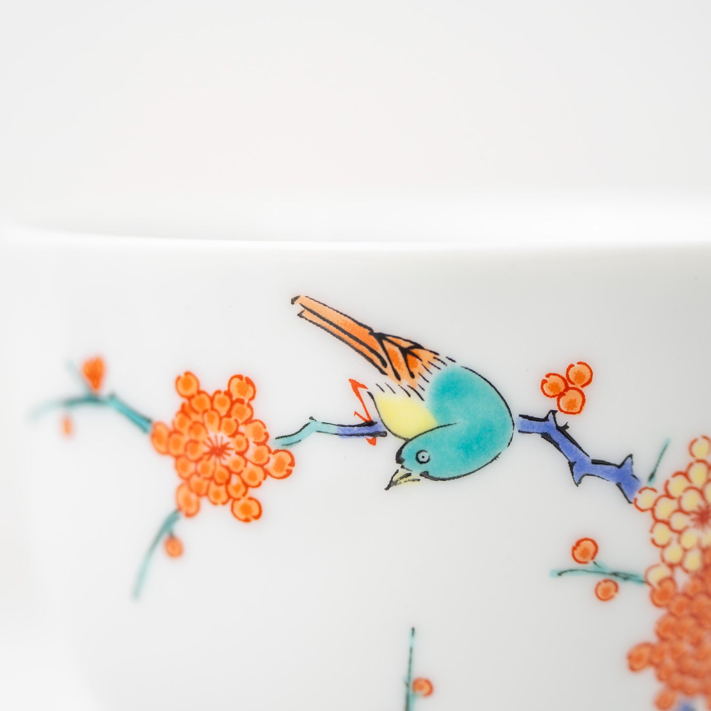 Detail of the footed base and painted motif on an Arita coffee cup