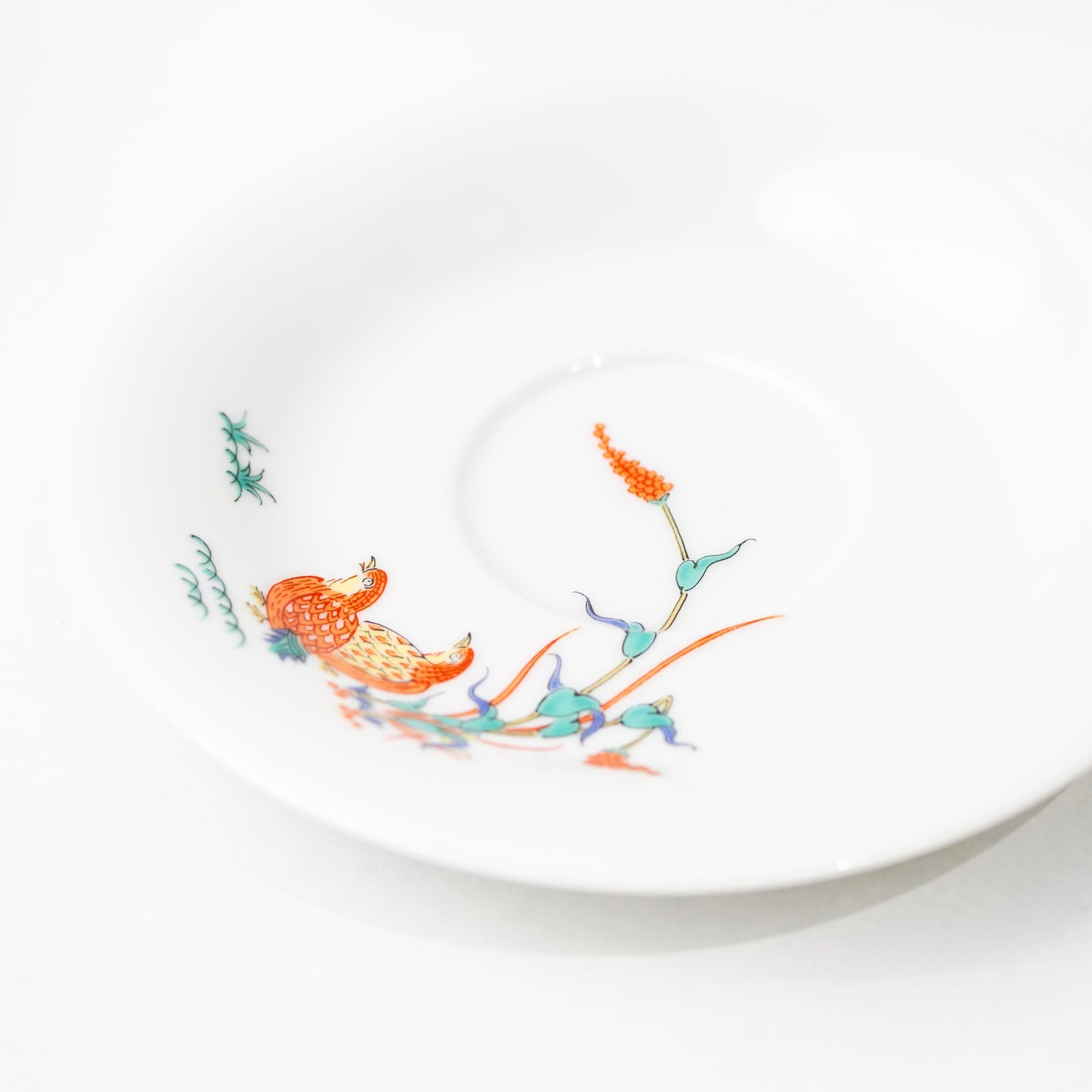 Side view of Japanese porcelain coffee cup and saucer in Arita ware