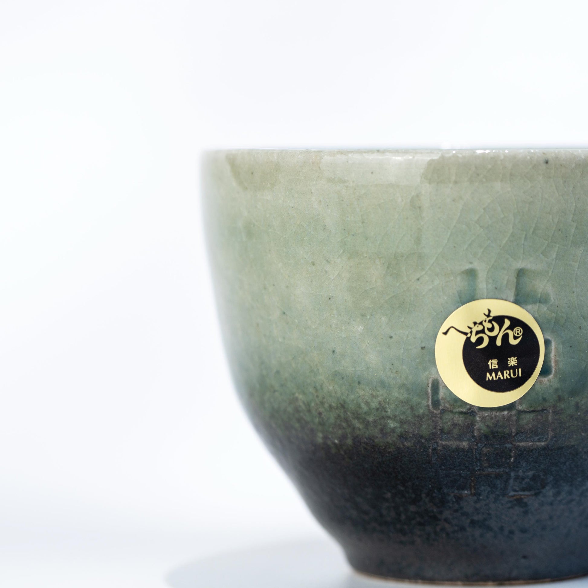 Side view of handmade Shigaraki cup and saucer set