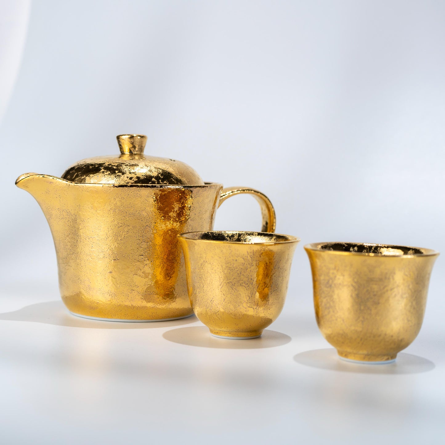 Complete Arita gold tea set displayed with wooden presentation box