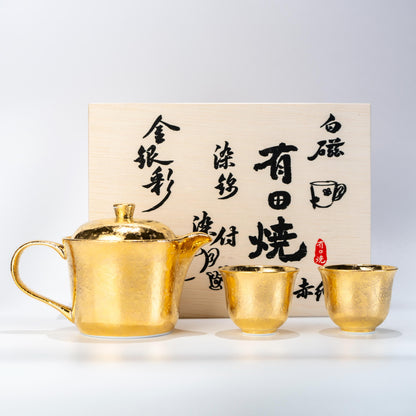 Arita gold glazed tea set with teapot and two cups in wooden box