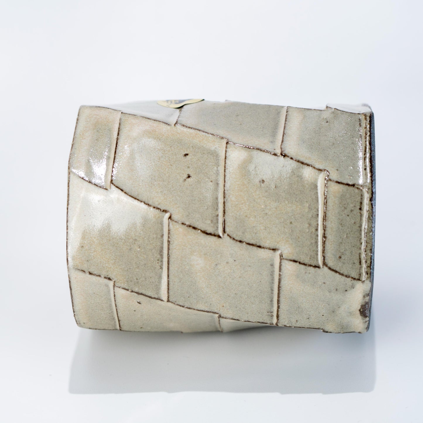 Side view of faceted Shigaraki stoneware mug