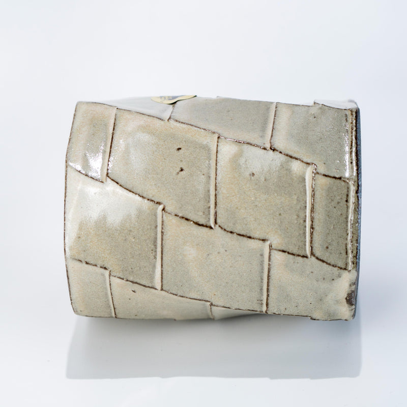 Side view of faceted Shigaraki stoneware mug