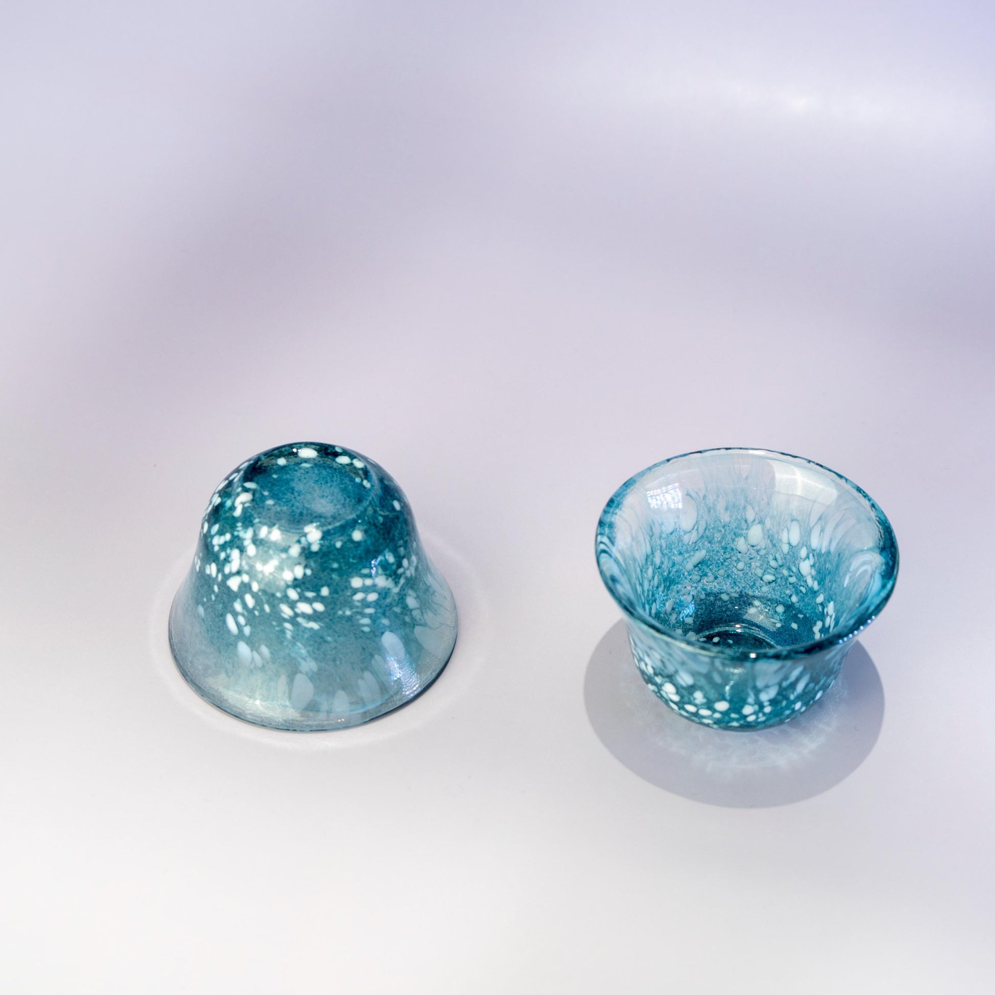 Two matching blue sake cups from Japanese glassware set