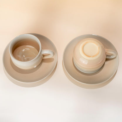 Two handmade Hagi yaki coffee cup and saucer sets in a soft blush glaze