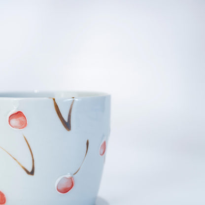 Close-up of the cherry motif on an Arita Hasami porcelain tea cup