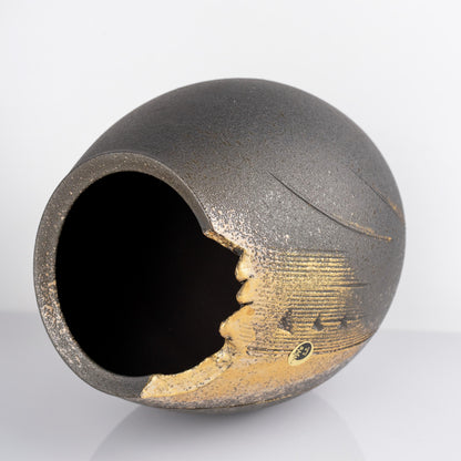 Close-up of the black and gold glaze on a handmade Shigaraki vase