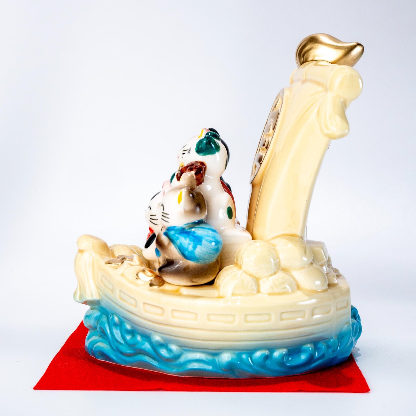 Full display view of seven lucky cats treasure ship figurine