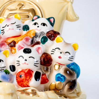Close-up of painted lucky cat details on Seto ware figure
