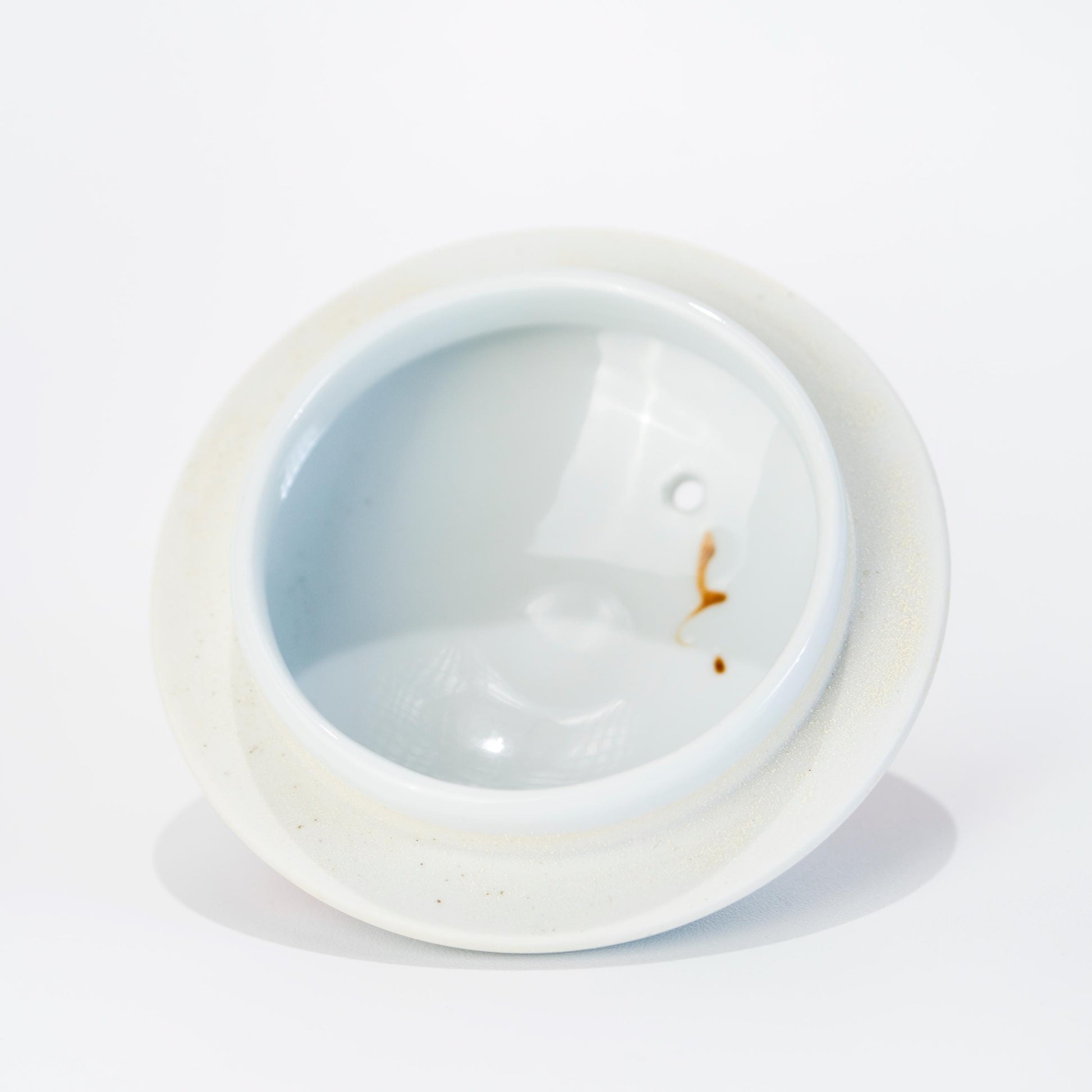 Interior view of porcelain teapot opening