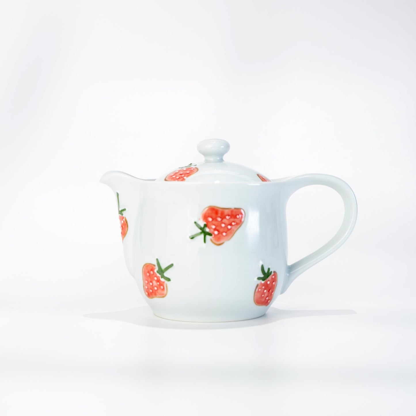 Front view of hand-painted Arita fruit teapot