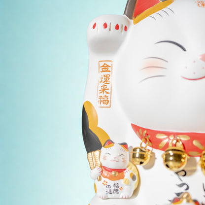 Front close-up of ceramic Maneki Neko with lucky figures