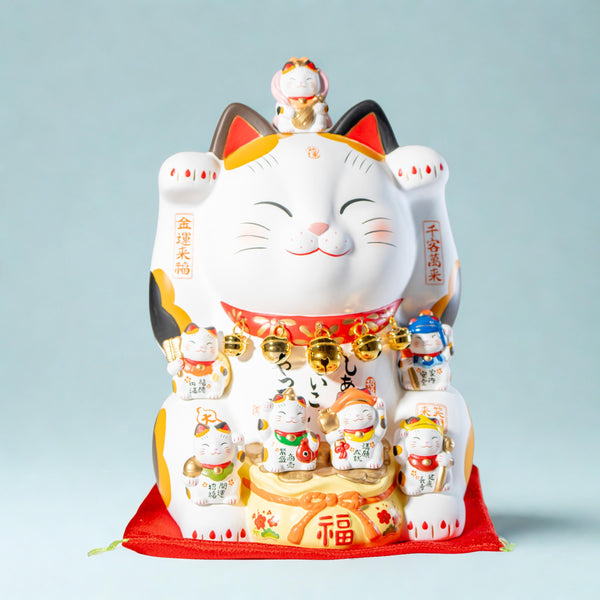Yakushi Kiln Maneki Neko with Seven Lucky Gods, both paws raised — Yakushigama double-paw beckoning cat from Seto, Aichi