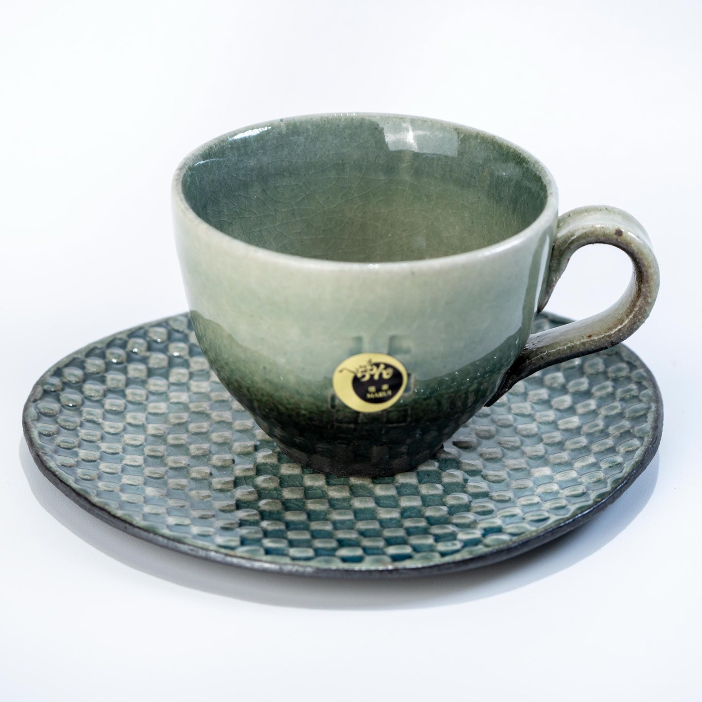 Shigaraki coffee cup and saucer set in olive green mosaic stoneware