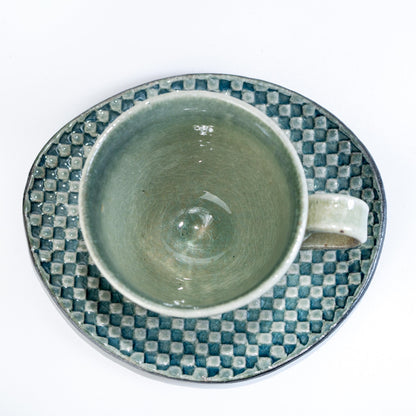 Top view of Shigaraki cup and saucer showing mosaic glaze pattern