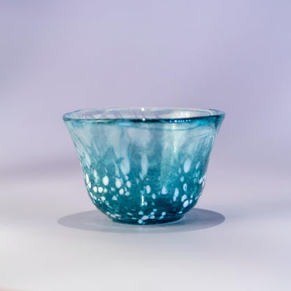 Close-up of blue sake cup in handmade Japanese glass