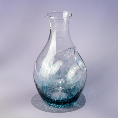 Top view of handmade blue sake carafe with flowing glass pattern