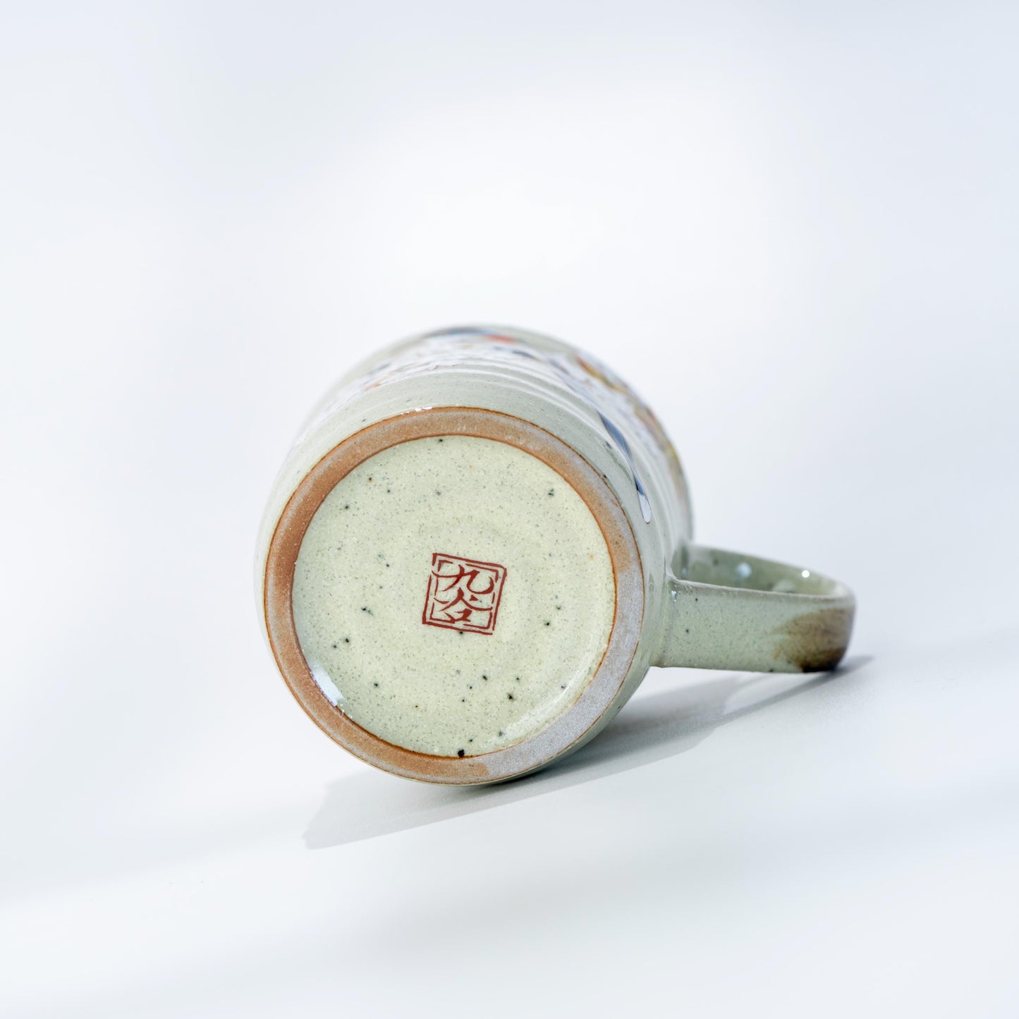 Base view of Kutani ceramic mug showing the underside and foot ring