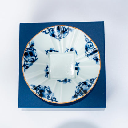 Top view of Arita ware porcelain bowl placed on a blue box