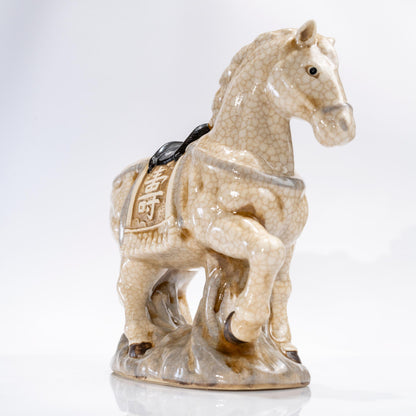 Three-quarter view of a ceramic lucky horse statue