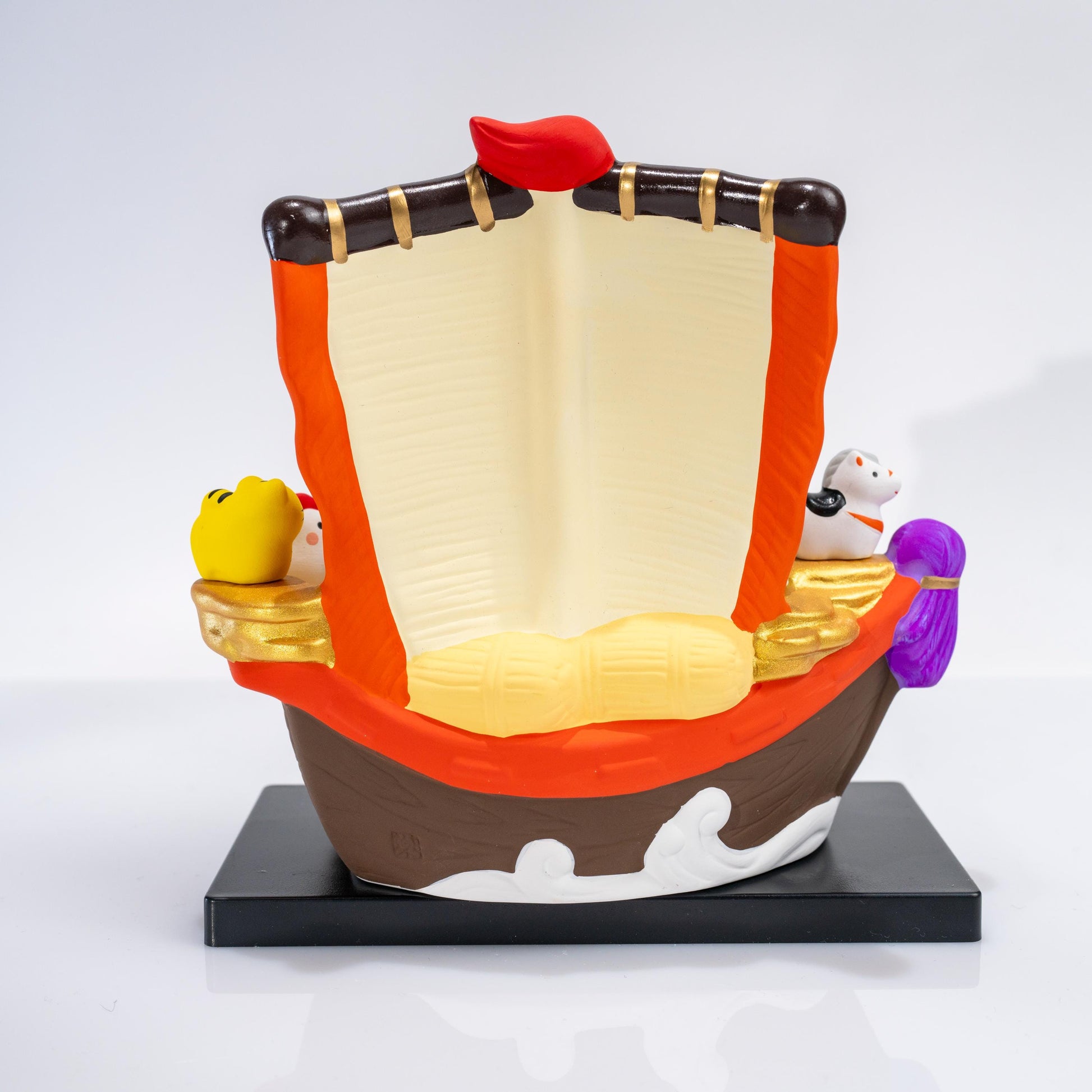Side detail of treasure boat with miniature zodiac animals