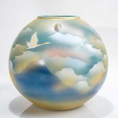 Full view of Kutani round porcelain crane vase on black stand