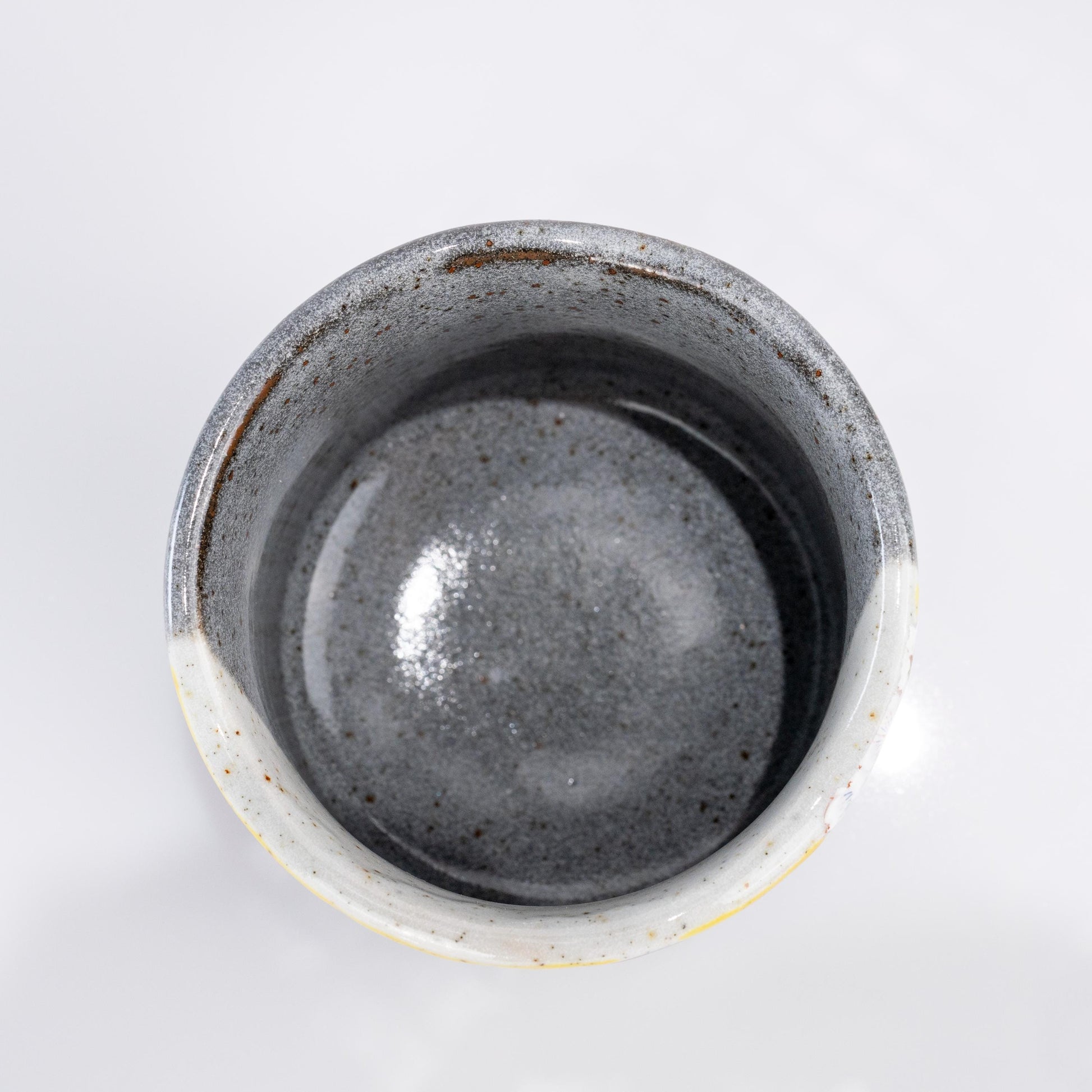 Top view of Kutani yunomi tea cup showing dark glazed interior