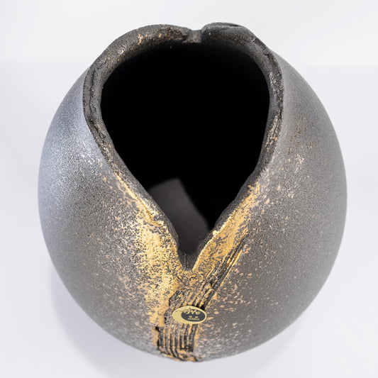 Top view of black gold Shigaraki vase showing V-shaped opening