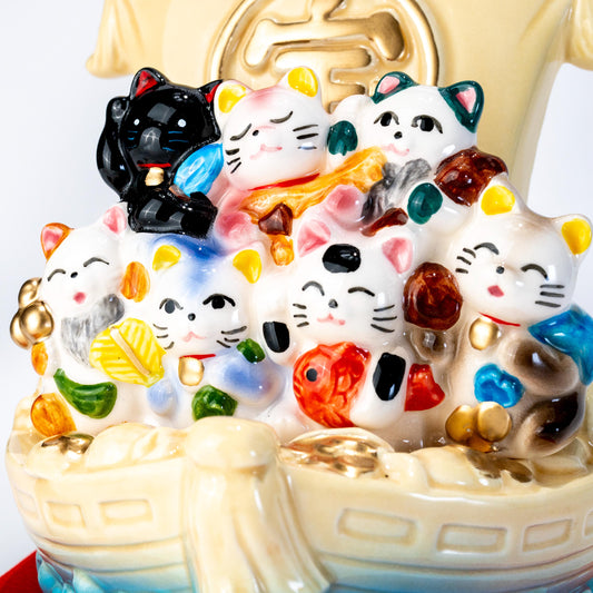 Front detail of cats on a ceramic treasure ship figurine