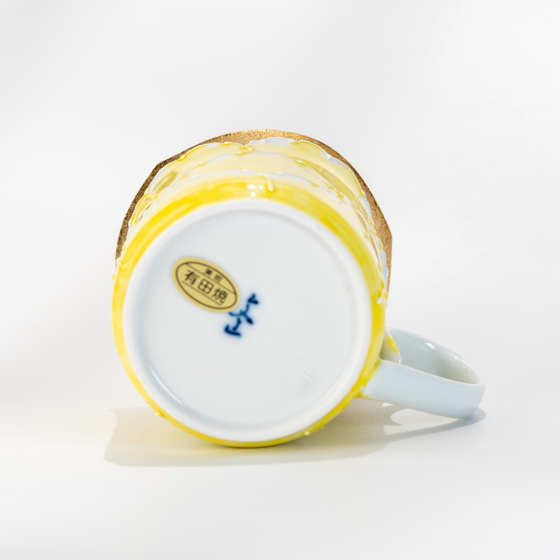 Underside of Arita mug showing base mark