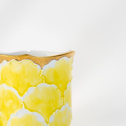 Side view of embossed floral mug in Arita porcelain