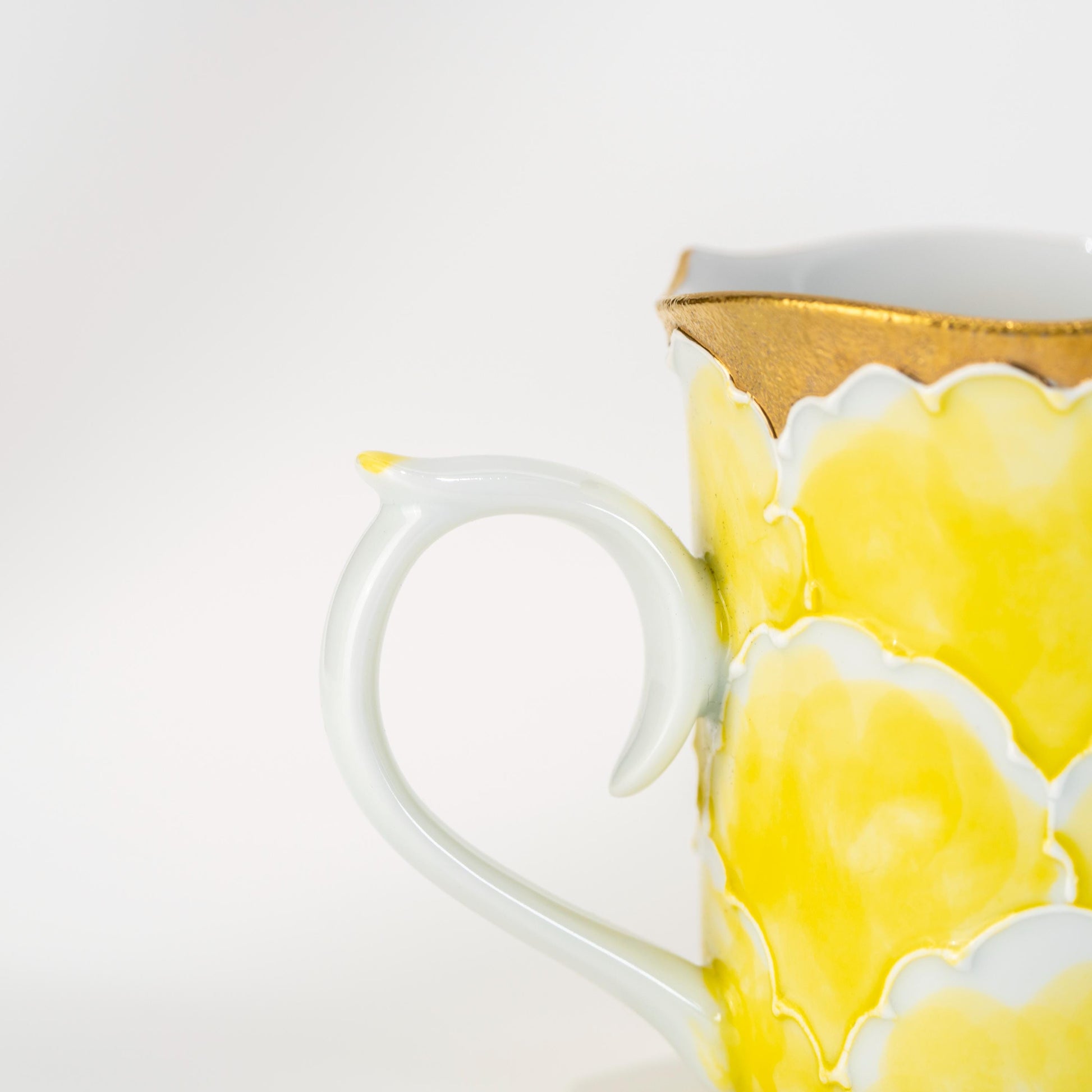 Front view of floral porcelain mug with handle