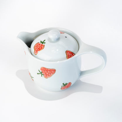 Arita strawberry teapot in hand-painted porcelain on white background