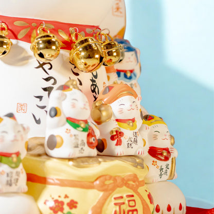 Close-up of decorative figures on Yakushi Kiln Maneki Neko