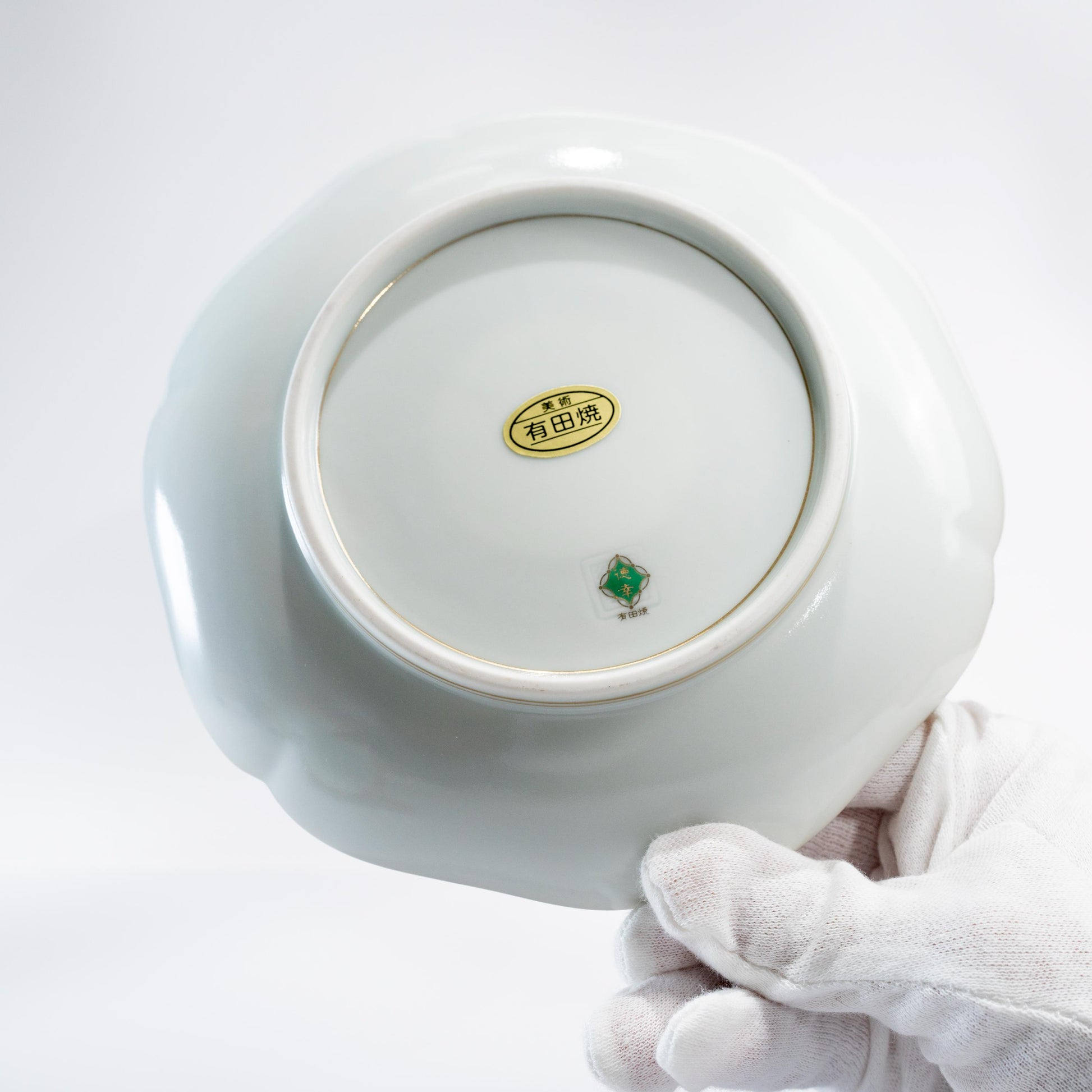 Underside of Arita porcelain saucer showing base and foot ring