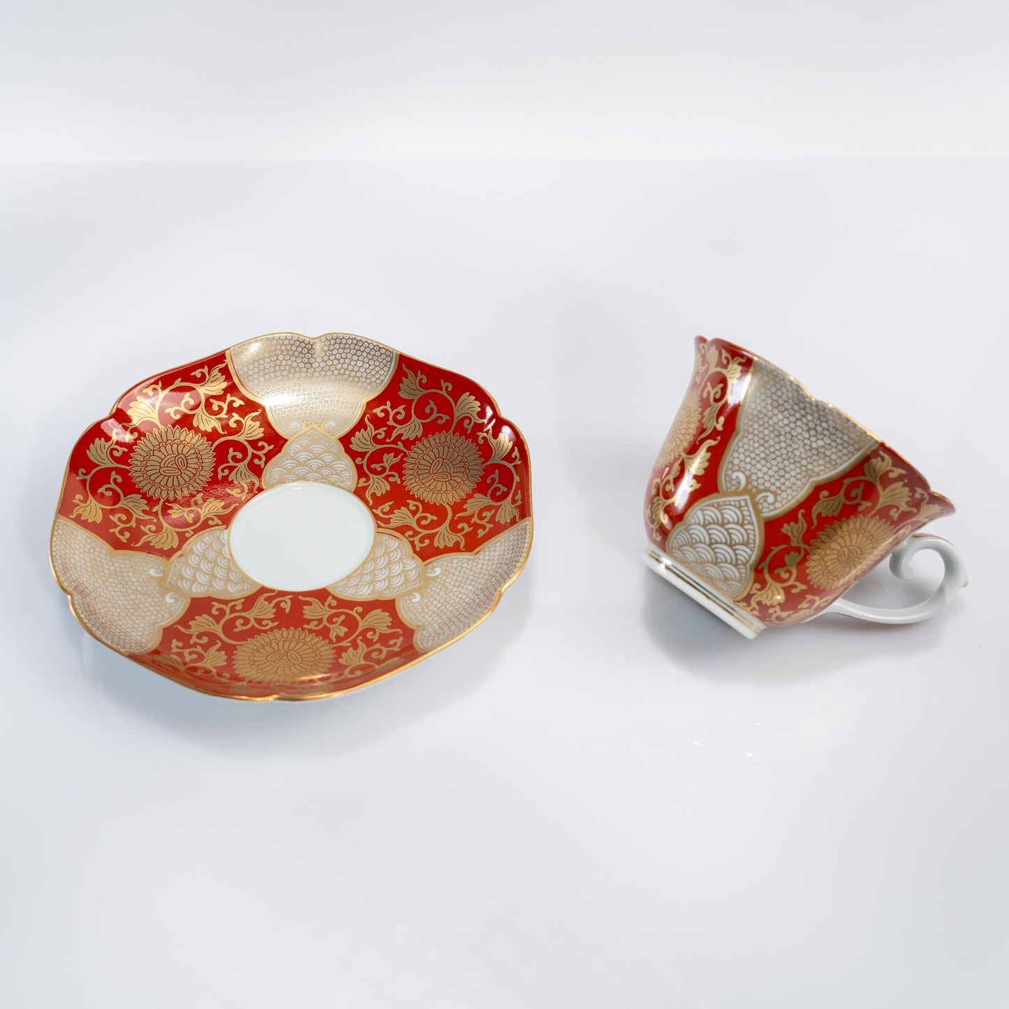 Close-up of red gold chrysanthemum detail on the cup